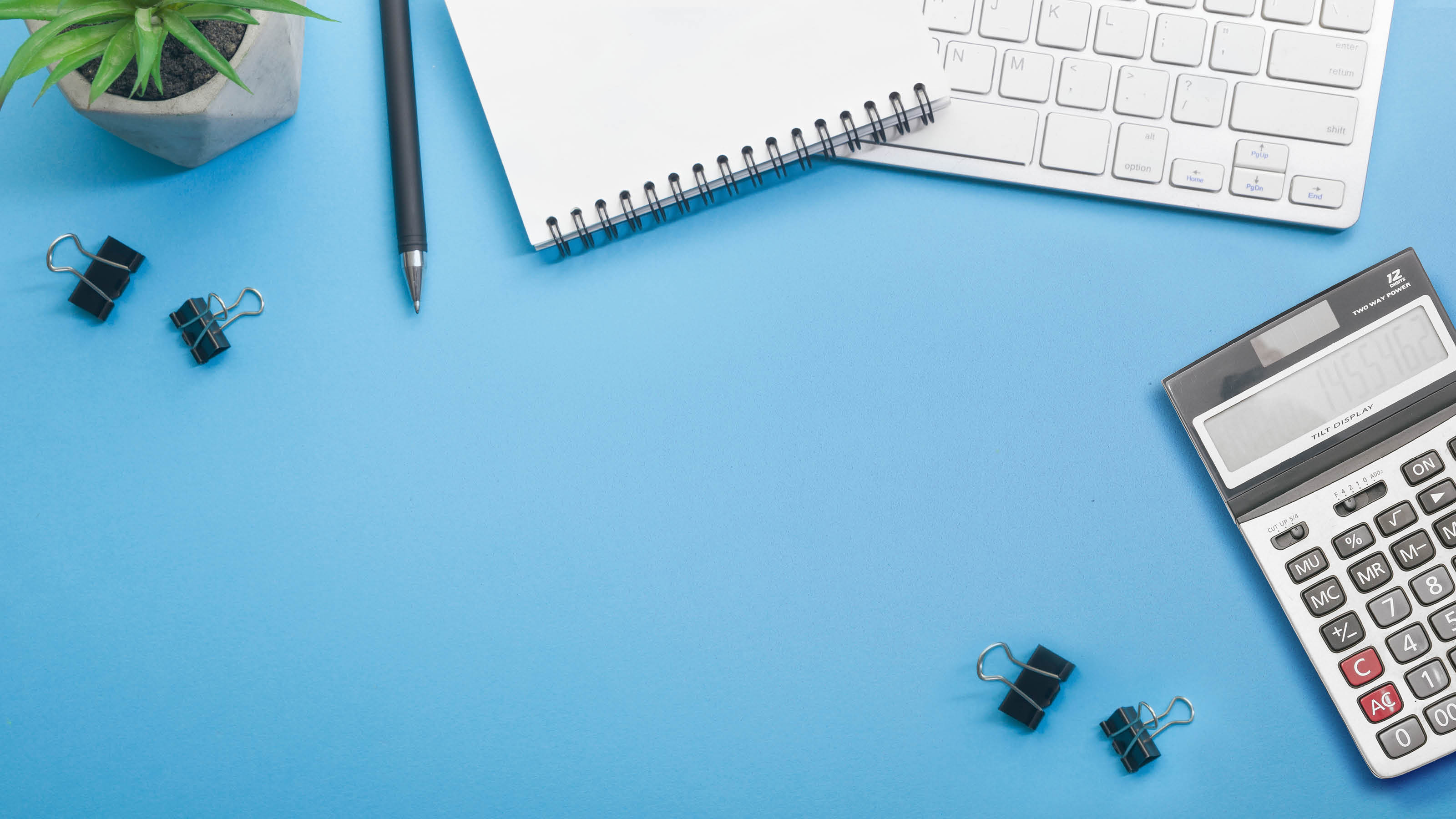 Blue desk office with laptop, smartphone and other work supplies with cup of coffee  Top view with copy space for input the text  Designer workspace on desk table essential elements on flat lay