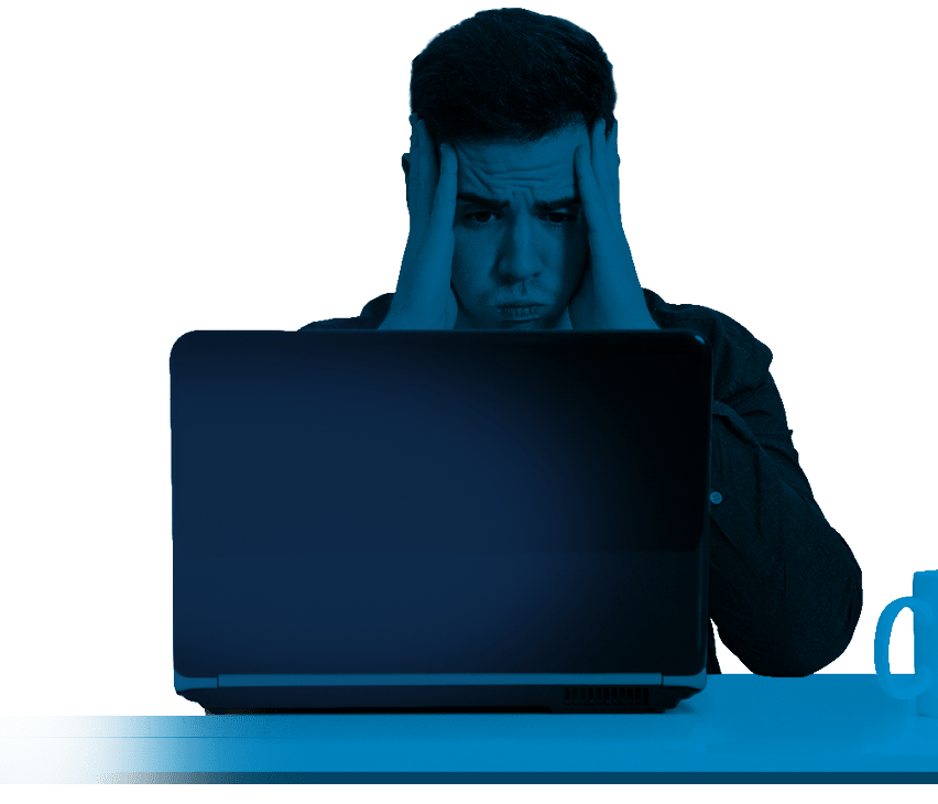 young man in front of the computer laptop concentrated or overwhelmed