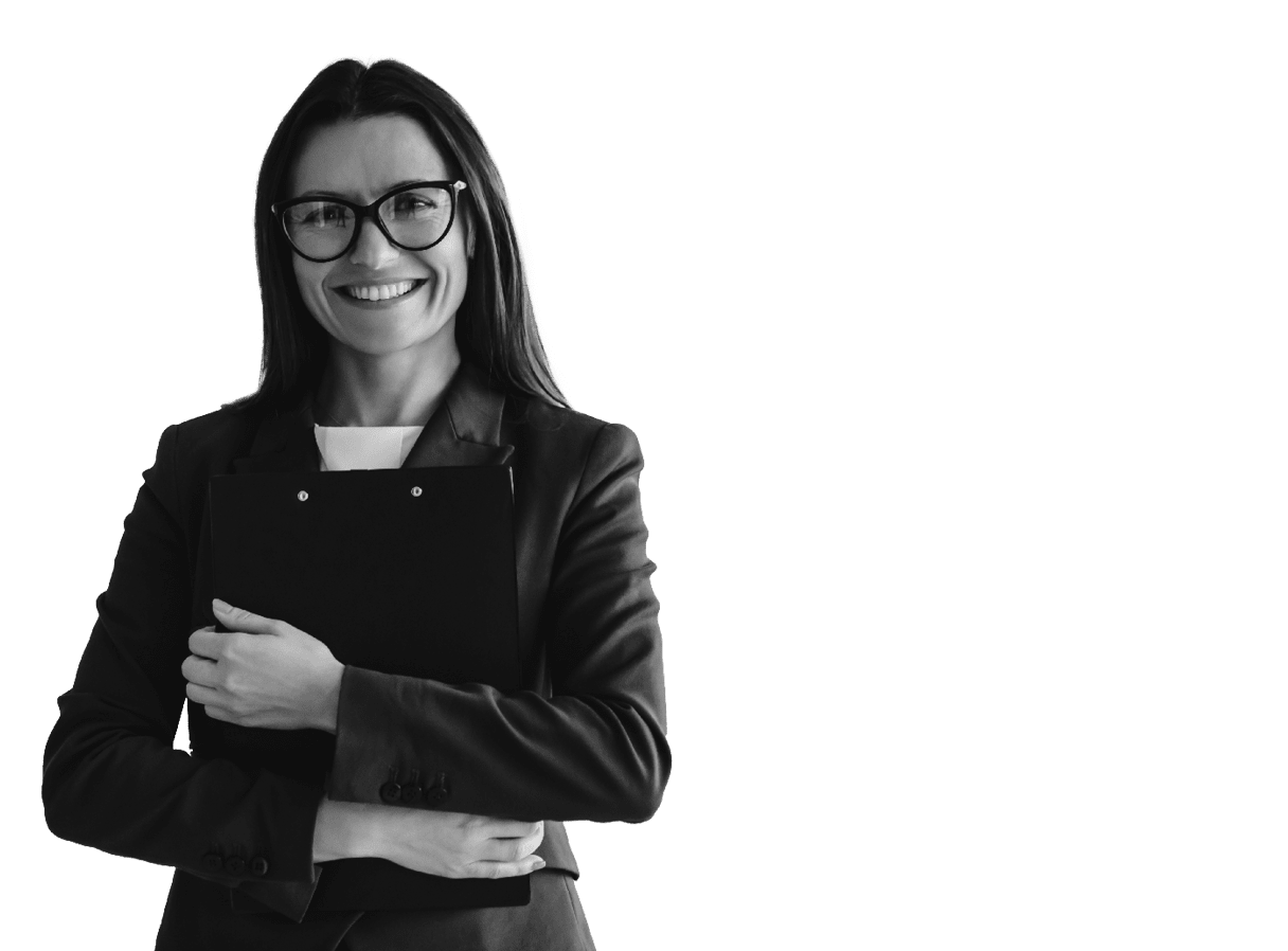 Portrait of pretty office female employee with folder in hands, smiling lovely at the camera and her coleagues discussing something on blurred background.