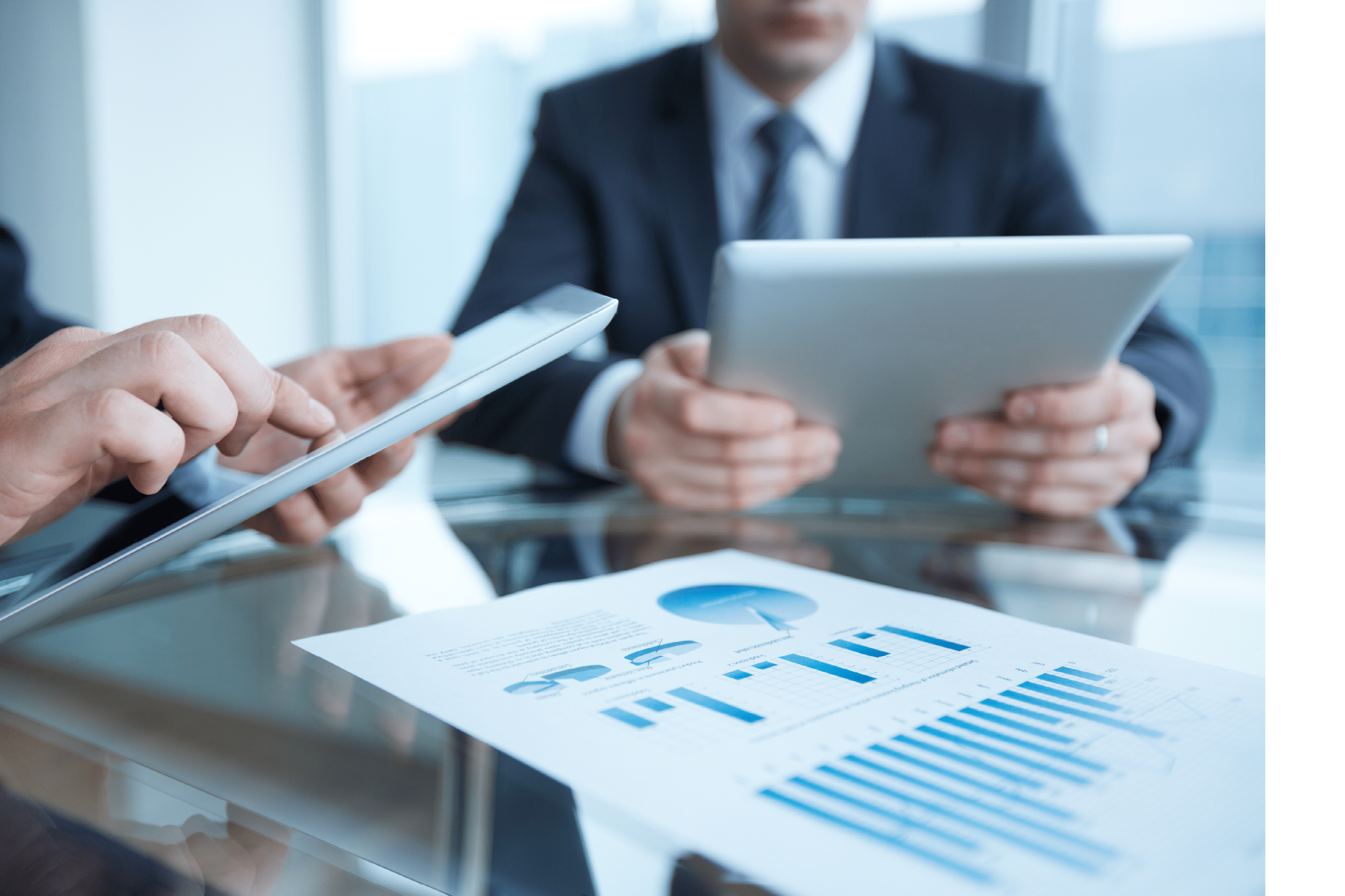 Close-up of business partners using touchpads