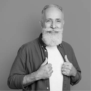 Photo portrait of elder man smiling wearing green shirt isolated vivid yellow color background
