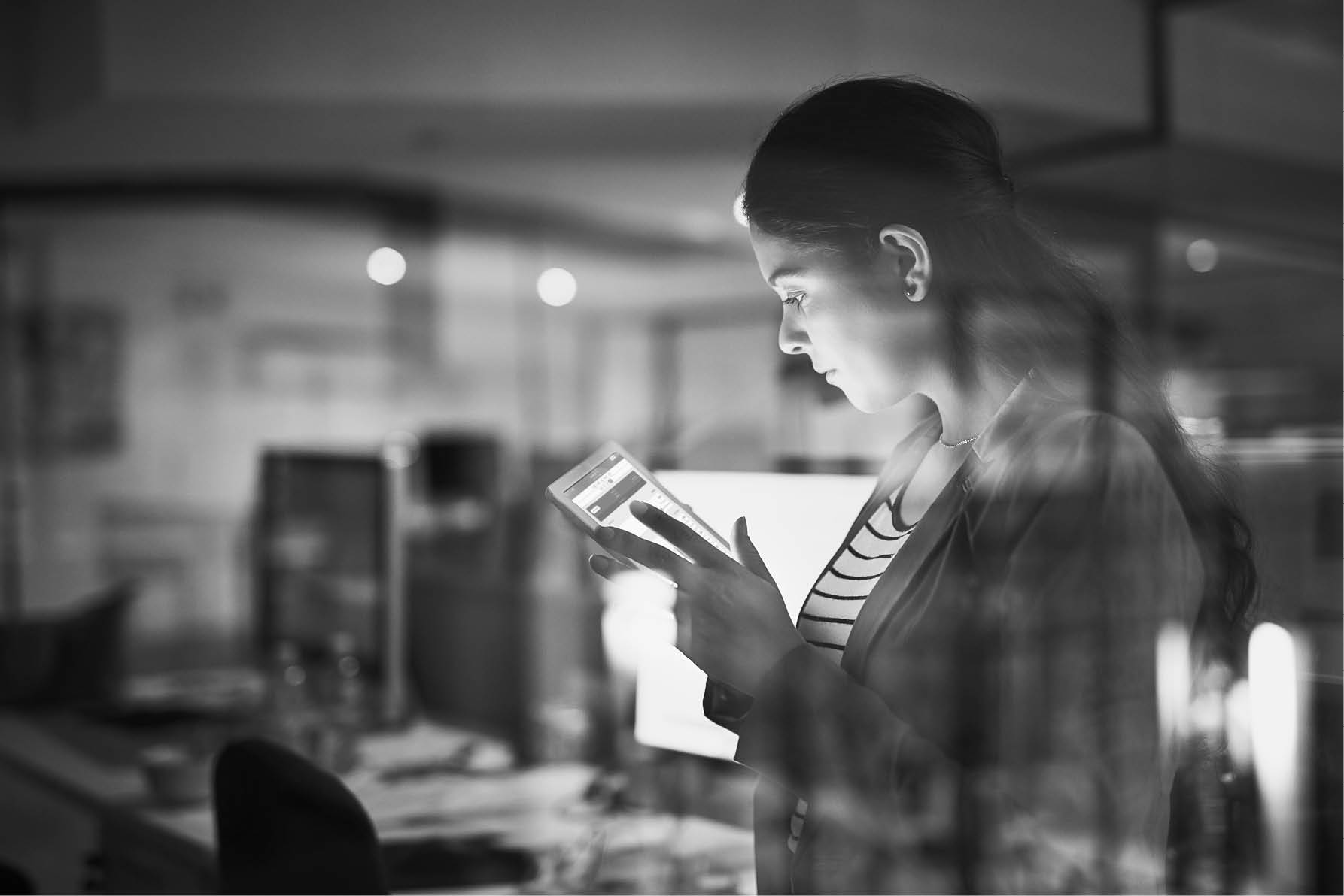 Shot of a young businesswoman working late in the office