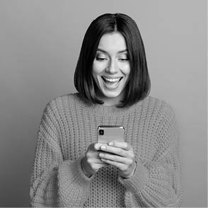 Portrait of attractive cheerful amazed girl using device gadget app smm post isolated over bright green color background