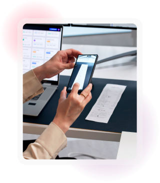Employee photographing a receipt with a smartphone to record an expense
