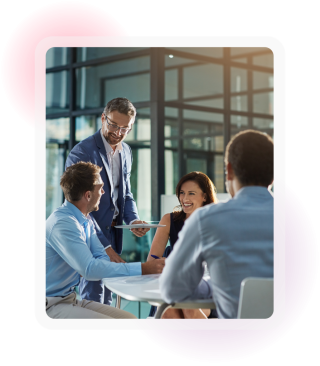 Colleagues discussing documents together during a workplace meeting