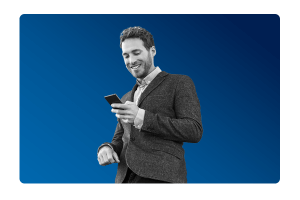 a man holding his mobile happy after gaining a faster close due to MHR's financial reporting integration.