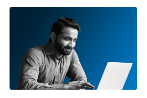 Man at laptop smiling after iTrent People Analytics Platform shows business analytics to help drive smarter business strategy
