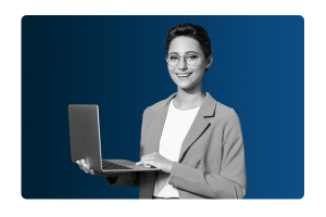A lady with glasses holding a laptop smiling