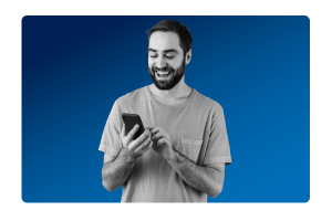 A man smiling at his mobile after managing data governance and security with ease with MHR's data strategy consultancy.