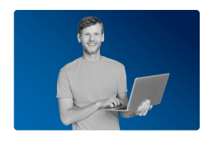 a man holding a laptop smiling after simplifying his financial planning with MHR's financial planning integration.