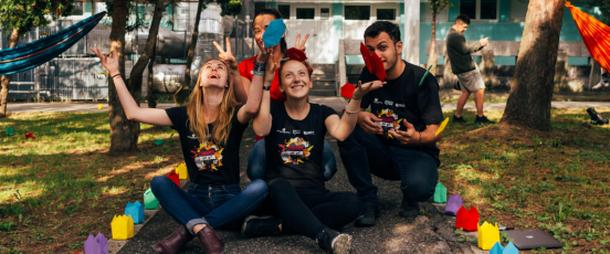 Three people looking very happy to be volunteering and giving back to the community