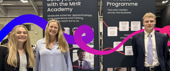 Three MHR graduates at a university careers fair
