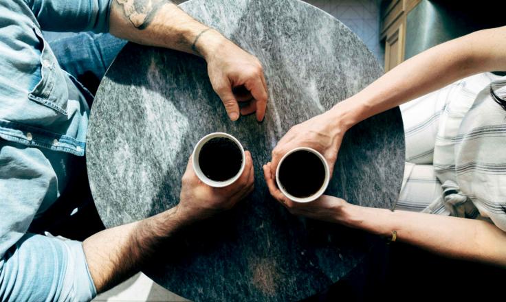 Top view of two people having coffee