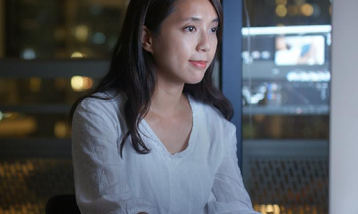 woman in front of screen at home
