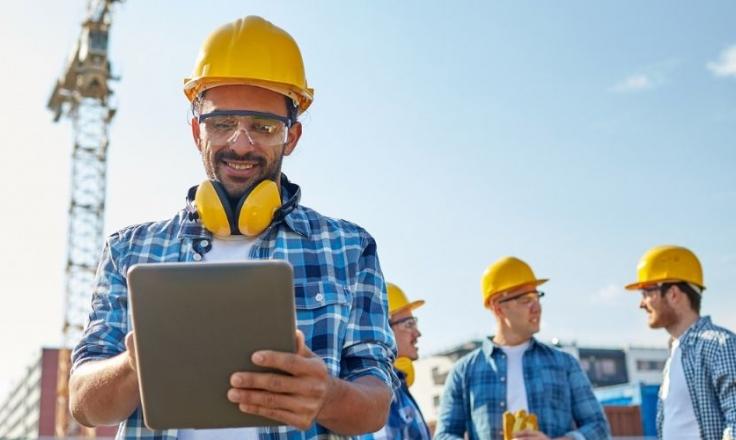 Construction worker on tablet