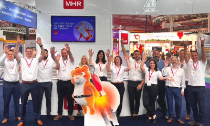 MHR sales team with their hands in the air at CIPD Festival of Work 2022.