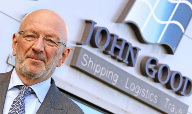 Stewart Oades, chairman of John Good Group, standing in front of the company building.