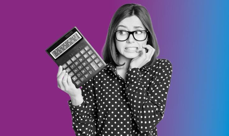 a lady holding a calculator worried