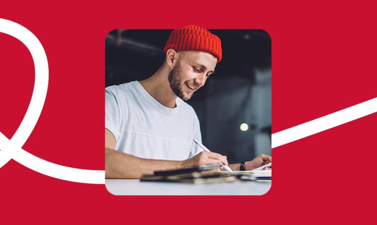 A man working from home with a tablet and digital pen.