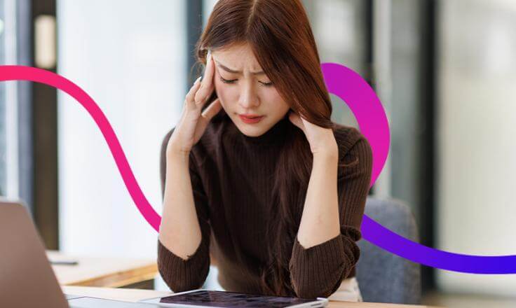 A lady with her head in her hands.