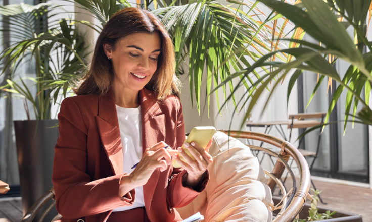 business woman looking at her smartphone