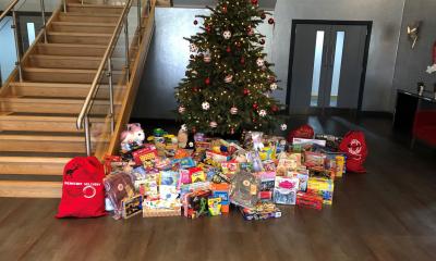 Presents around Christmas tree at MHR site