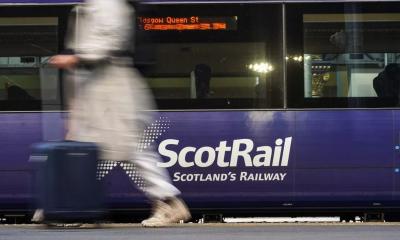 Scotrail case study grid image, showing Scotrail train and person walking past.