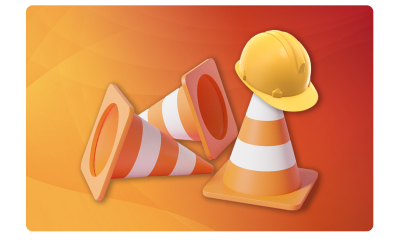 Construction traffic cones and hard hat. 