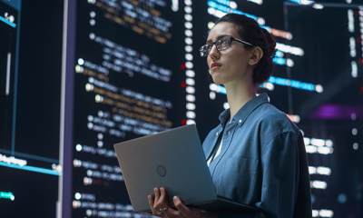 Lady looking at laptop with coding in engineering at MHR 