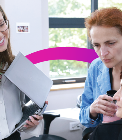 Three MHR female employees discussing work at MHR