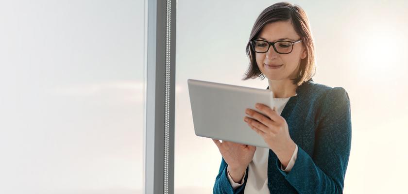 Tech sector header - woman using tablet