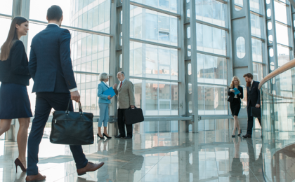 Two government workers walking into the office 