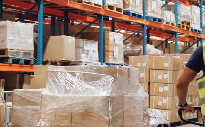 Two transport and logistics workers in the warehouse