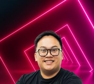 vu tran in front of pink neon squares mhr summit speaker headshot