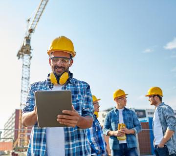 Construction worker on tablet