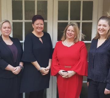 four female MHR mental health first aiders smiling