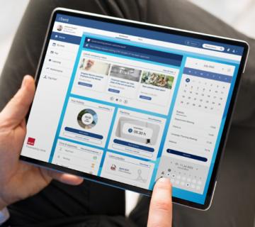 iTrent on a iPad screen in a man's hand