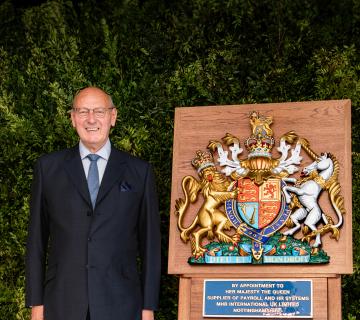 Mr John Mills with the Royal Warrant