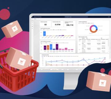 Desktop showing data dashboard surrounded by retail boxes