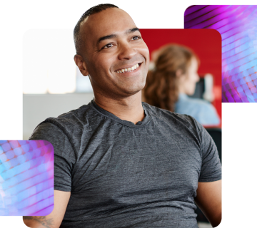 a man sat smiling, happy after using recruitment and onboarding software through MHR.