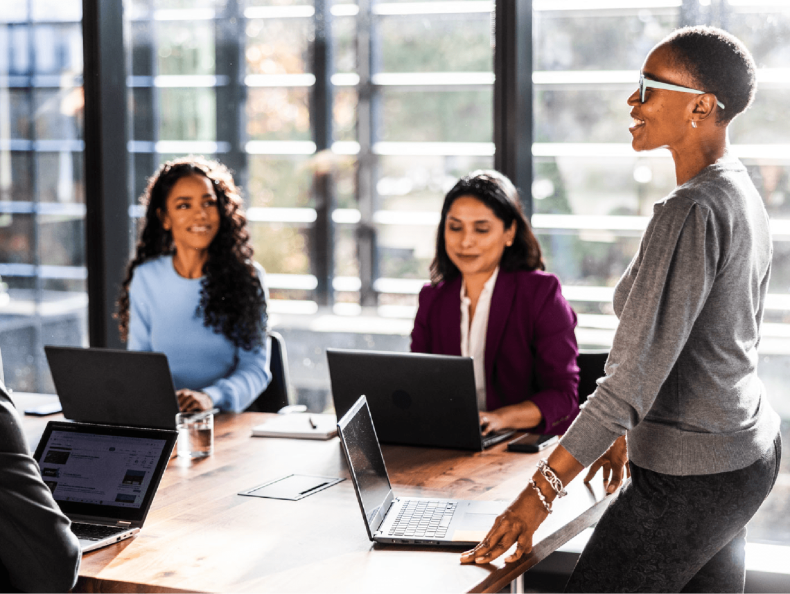 Women work around a table.