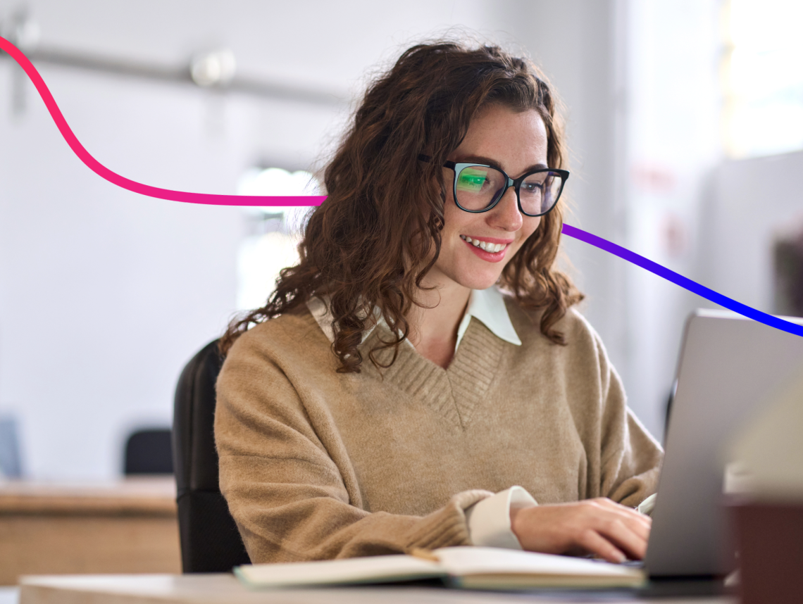 Lady at a laptop, smiling