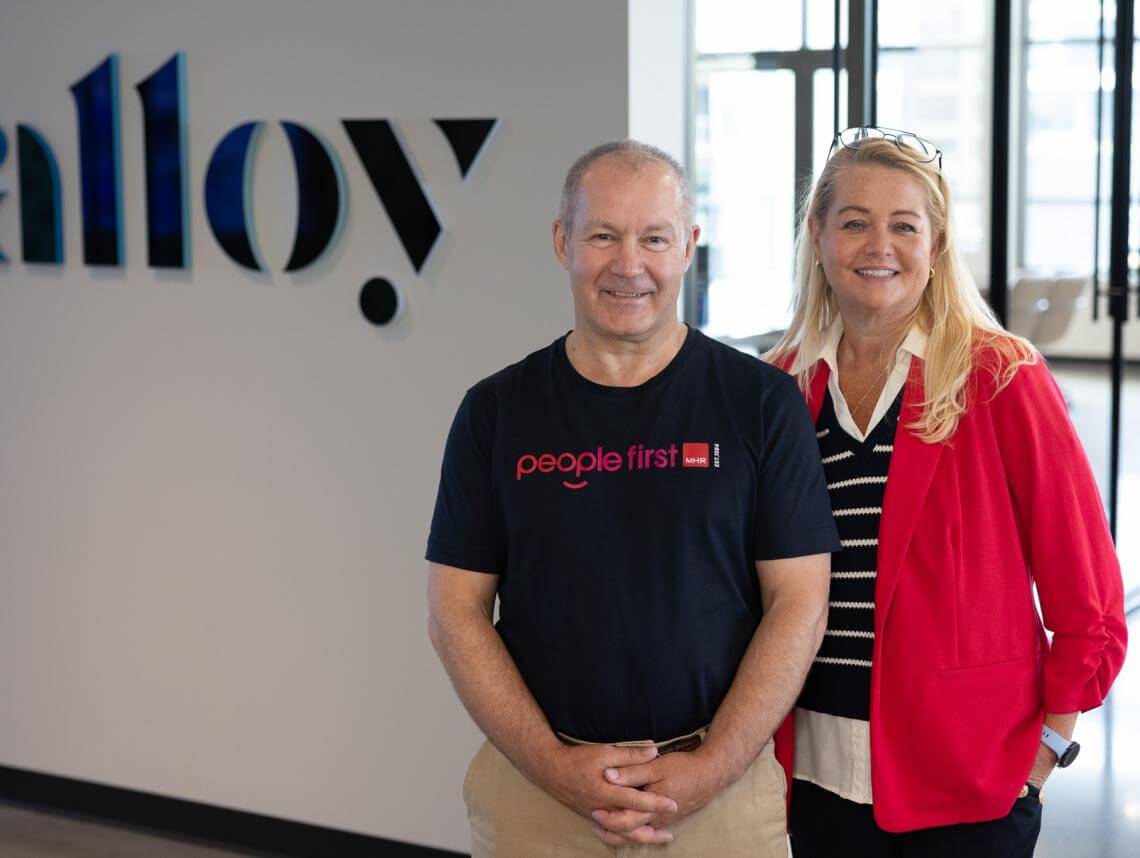 Andy Davies VP of Operations at MHR stood with Jenni McDonough CPO of Alloy