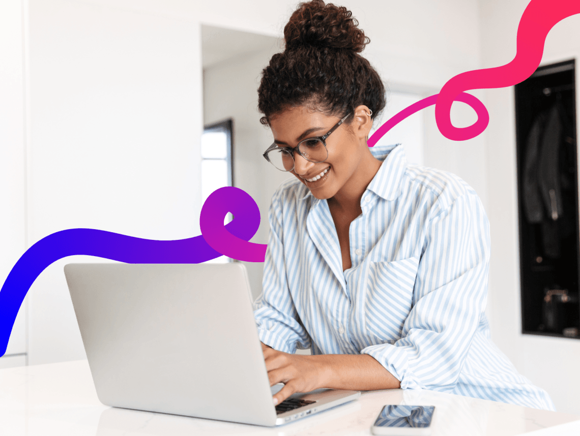 Woman sat typing on laptop