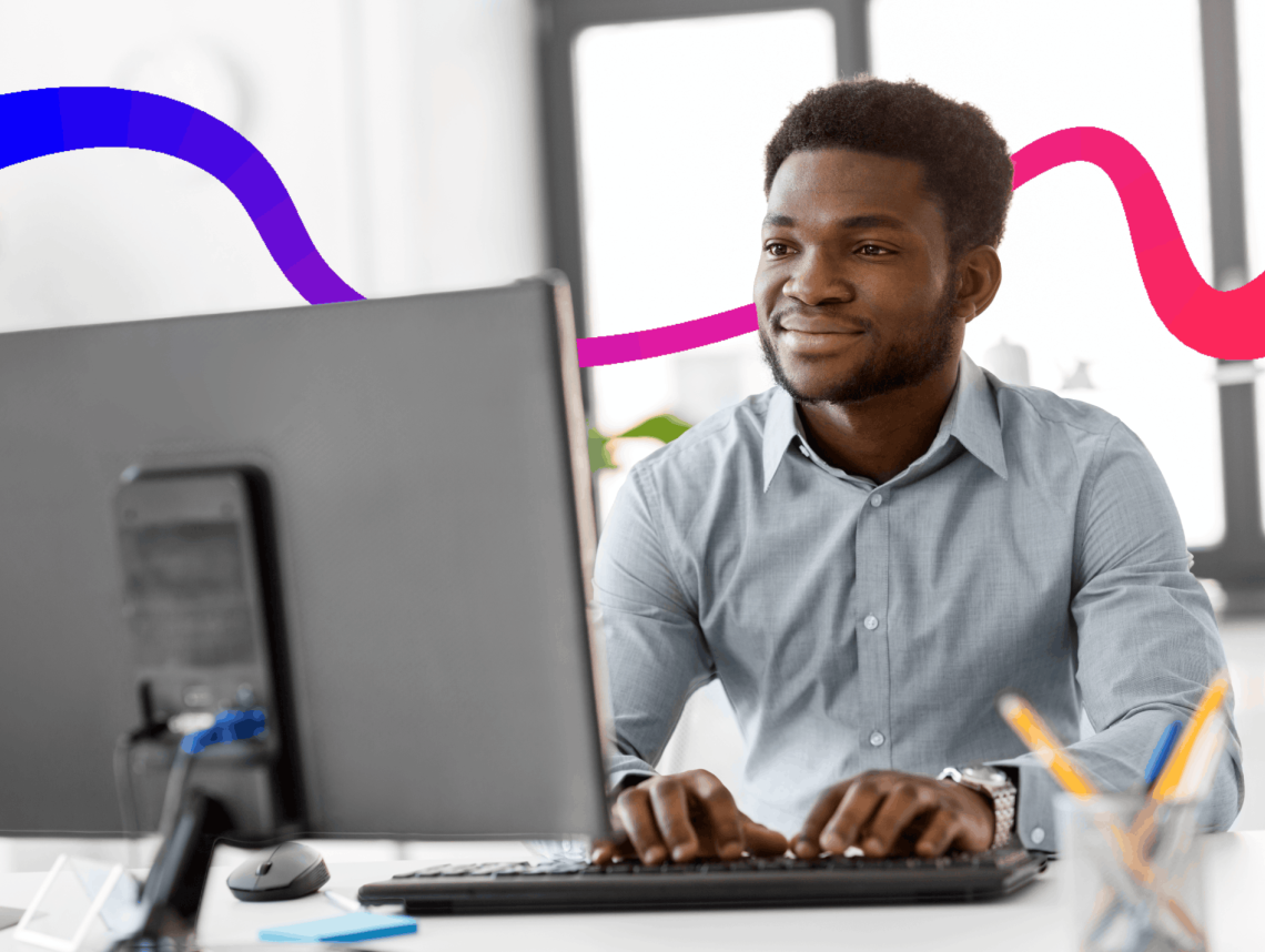man typing on a computer