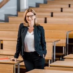 Teacher stood in auditorium