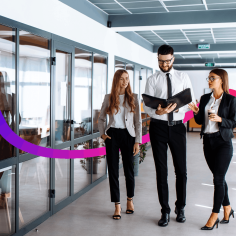 3 people walking in an office