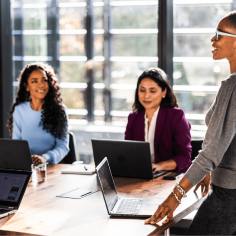 Women work around a table.