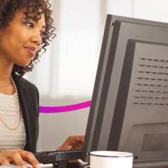 woman in an office using a computer