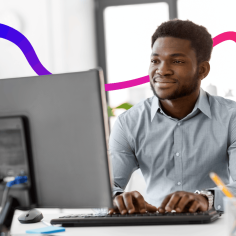 man typing on a computer
